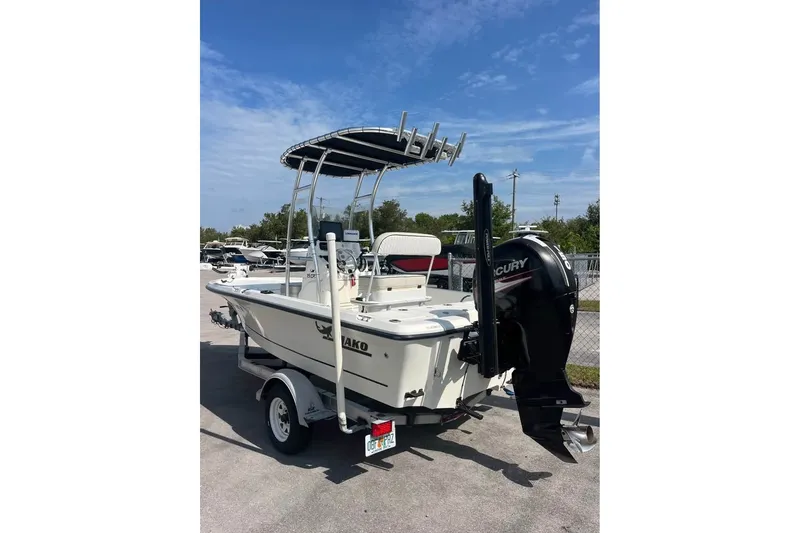Slide: The Image of 2016 Mako 19 CPX boat with Mercury outboard motor on trailer. - 3