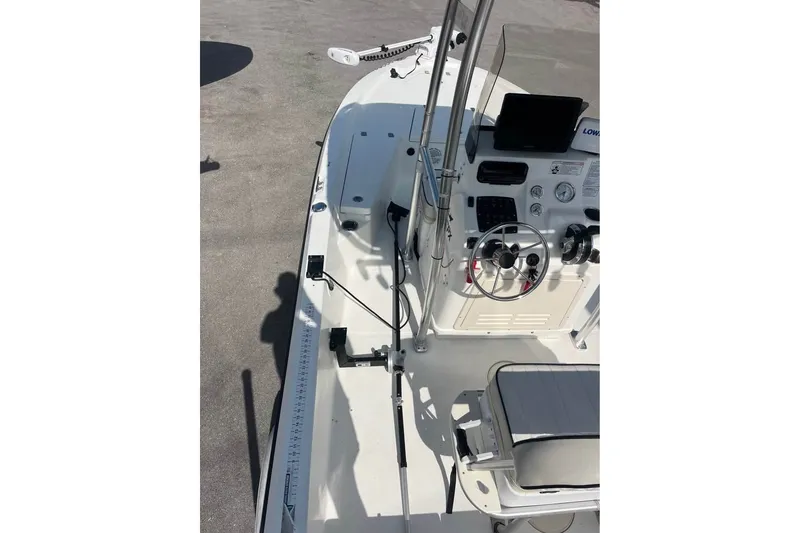 Slide: The Image of 2016 Mako 19 CPX boat interior with steering console and seating. - 5