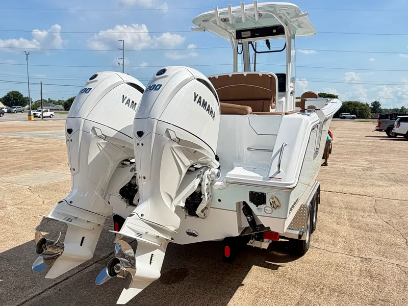 Slide: The Image of The image shows a 2027 Sea Hunt Ultra 265 SE boat with twin Yamaha outboard engines. - 5