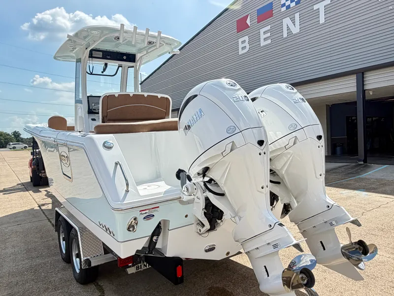 Slide: The Image of The image shows a 2027 Sea Hunt Ultra 265 SE boat with twin Yamaha engines. - 6