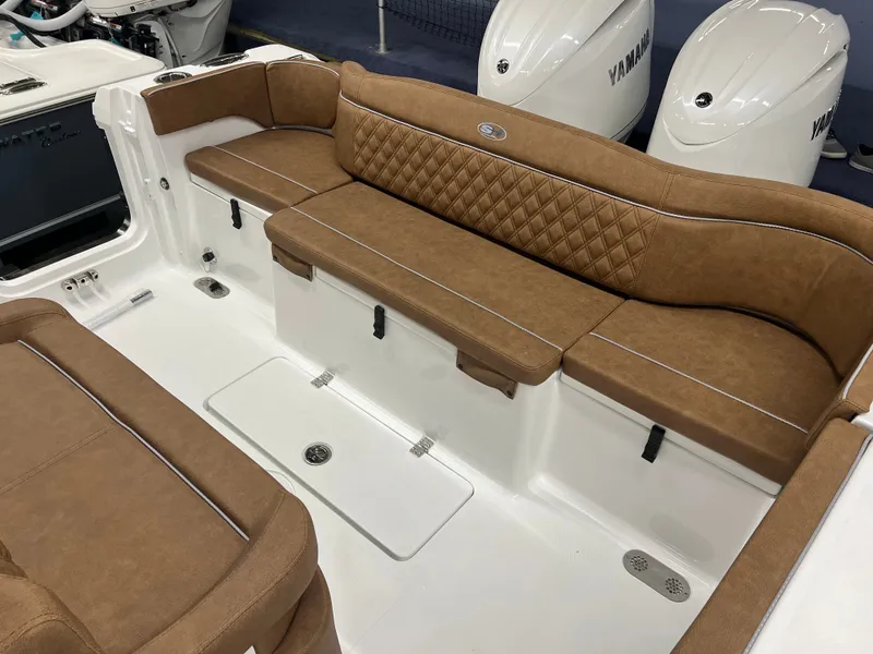 Slide: The Image of The 2027 Sea Hunt Ultra 265 SE features luxurious brown upholstery and two Yamaha engines. - 12