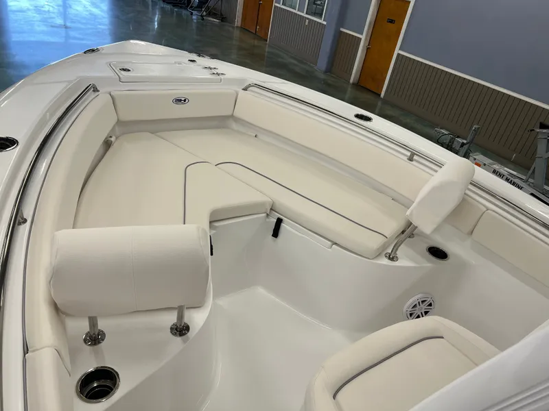 Slide: The Image of The image shows the bow area of a 2027 Sea Hunt Ultra 219 boat with white upholstery. - 11