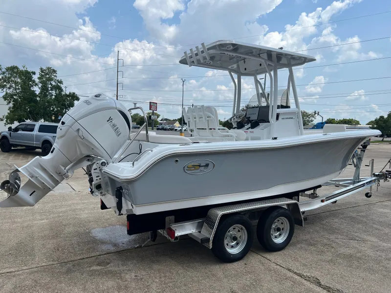 Slide: The Image of A 2027 Sea Hunt Ultra 219 boat on a trailer. It features a Yamaha outboard motor. - 3