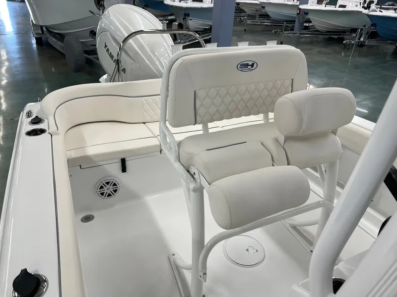 Slide: The Image of The image shows the cockpit of a Sea Hunt Ultra 219 boat with white upholstery and a Yamaha engine. - 13