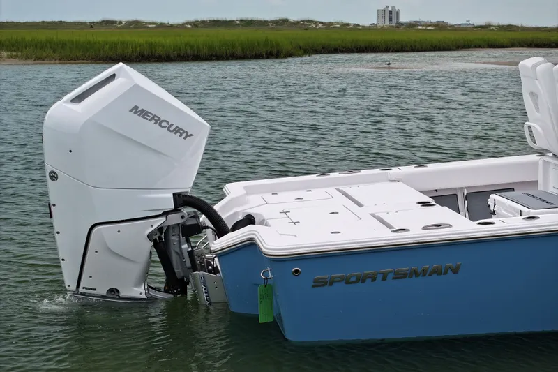 Slide: The Image of 2027 Sportsman Masters 267 Bay Boat with Mercury engine in calm waters. - 5