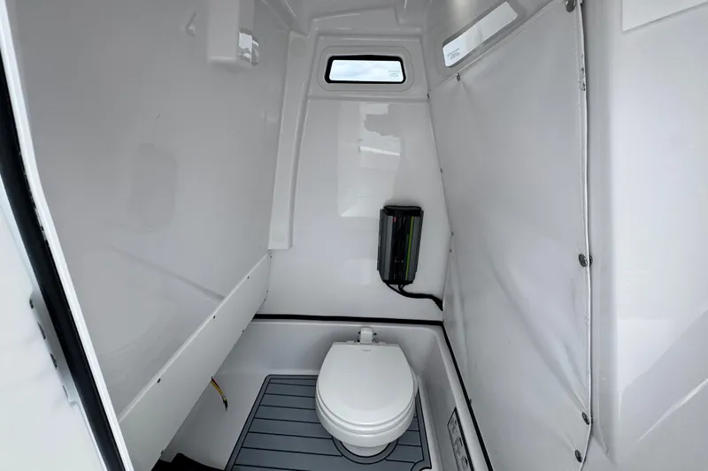 Slide: The Image of Interior of 2027 Sportsman Masters 267 Bay Boat with compact marine toilet. - 15