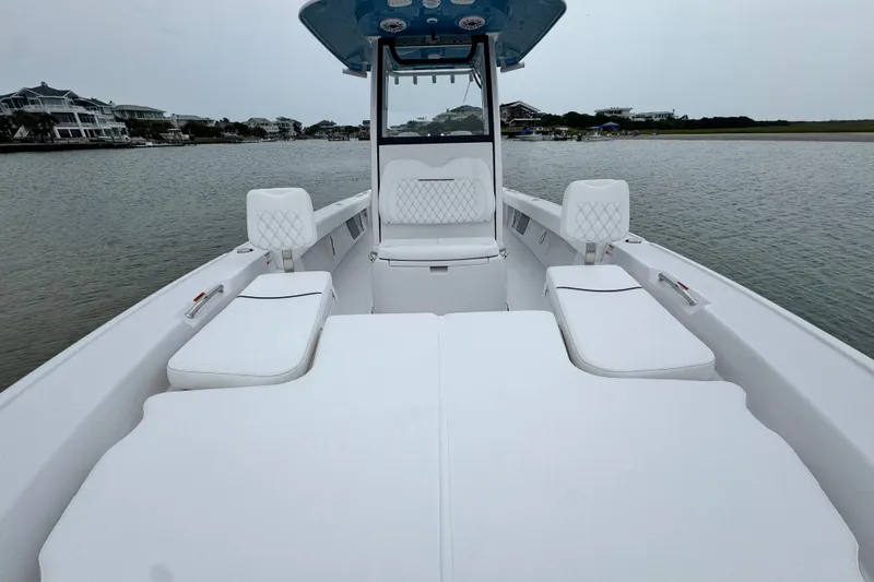 Slide: The Image of 2027 Sportsman Masters 267 Bay Boat with spacious seating on calm waters. - 11