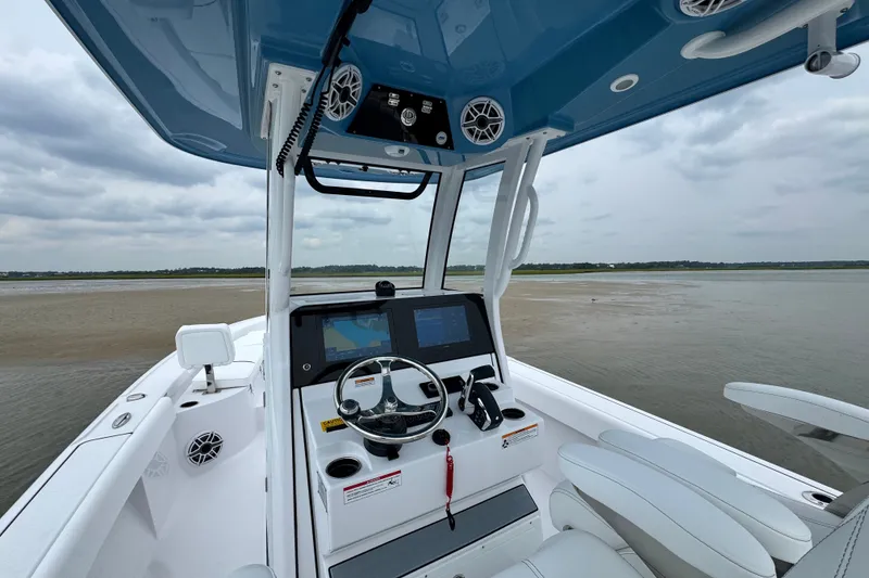 Slide: The Image of 2027 Sportsman Masters 267 Bay Boat interior with advanced navigation system and sleek design. - 17