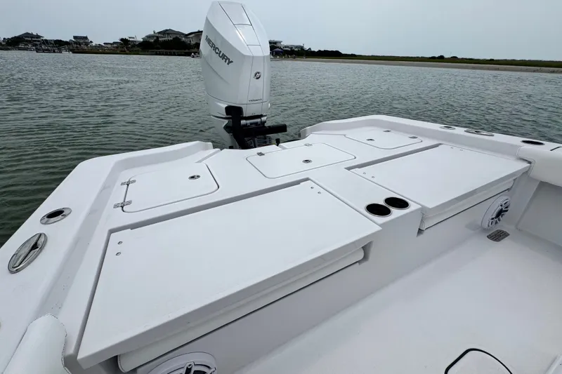 Slide: The Image of 2027 Sportsman Masters 267 Bay Boat with Mercury engine on calm water. - 23