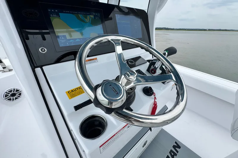Slide: The Image of Steering console of 2027 Sportsman Masters 267 Bay Boat with navigation display. - 18