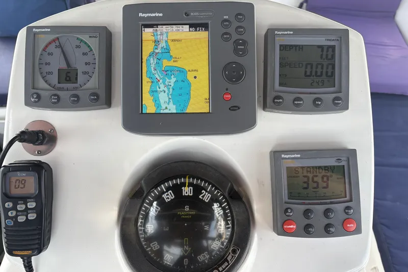 Slide: The Image of Control panel of a 2004 Jeanneau Sun Odyssey 37 sailboat with navigation instruments. - 12