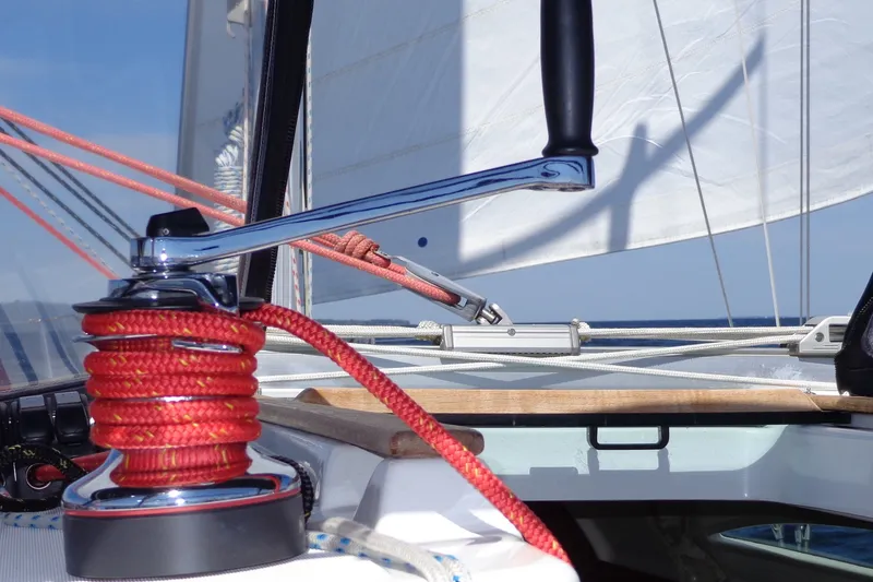 Slide: The Image of Close-up of Jeanneau Sun Odyssey 37 sailboat winch with red rope, 2004 model. - 15