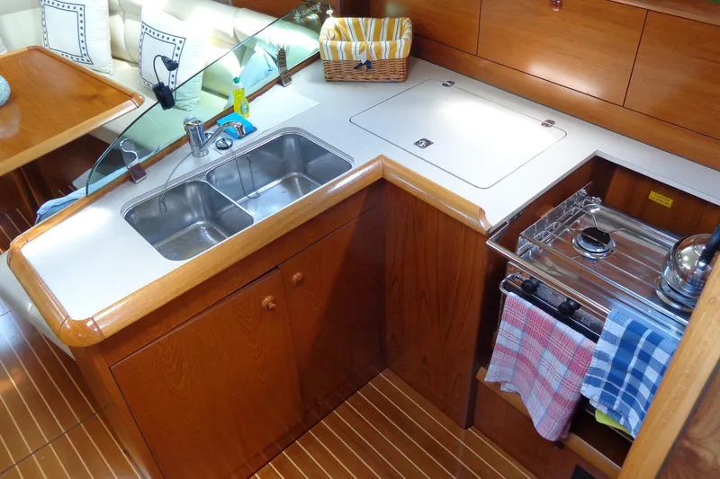 Slide: The Image of Interior of 2004 Jeanneau Sun Odyssey 37 yacht kitchen with sink and stove. - 18