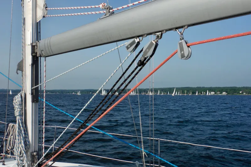 Slide: The Image of Sailing on a 2004 Jeanneau Sun Odyssey 37 with a view of the ocean and distant sailboats. - 9