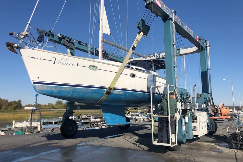 Slide: The Image of 2004 Jeanneau Sun Odyssey 37 sailboat lifted by a marine travel lift. - 35