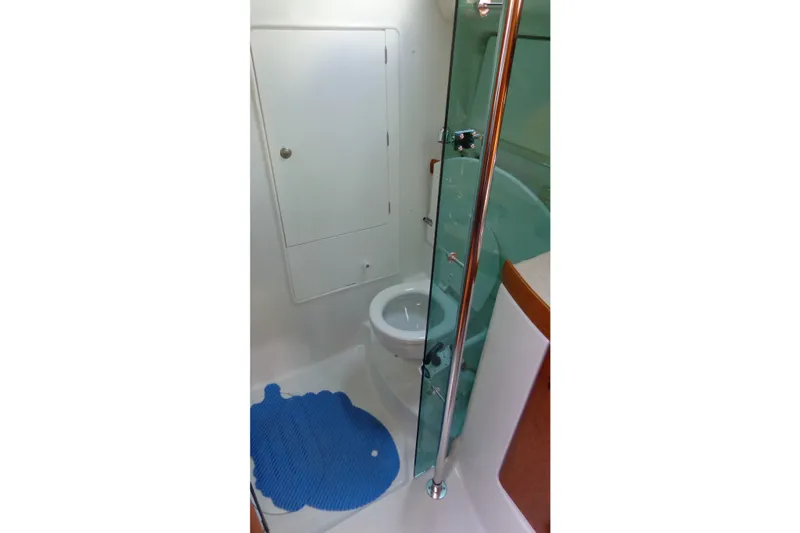 Slide: The Image of Bathroom interior of 2004 Jeanneau Sun Odyssey 37 yacht with shower and toilet. - 26