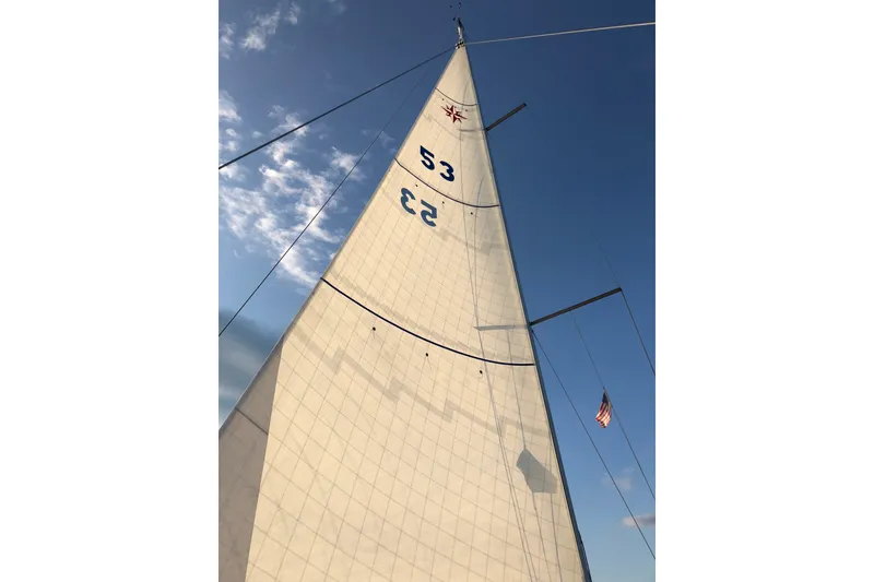Slide: The Image of Sail of a 2004 Jeanneau Sun Odyssey 37 against a clear blue sky. - 4