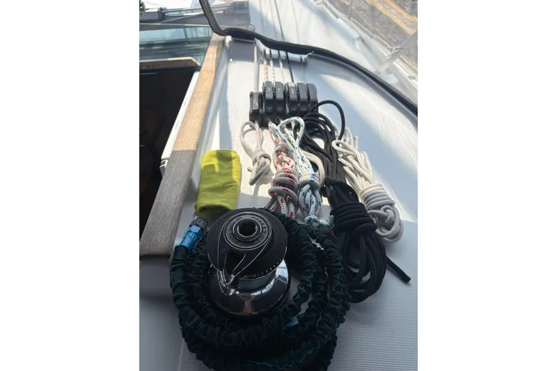 Slide: The Image of Deck of 2004 Jeanneau Sun Odyssey 37 with ropes and winch. - 14