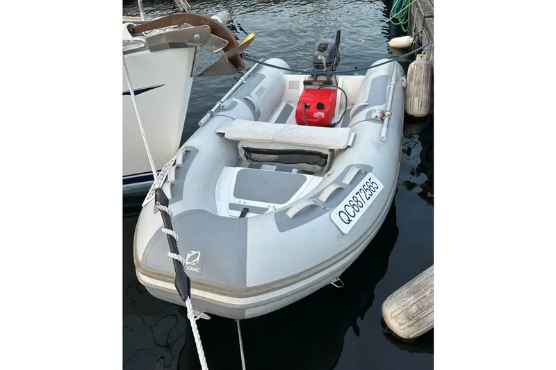 Slide: The Image of Inflatable Zodiac boat docked beside a Jeanneau Sun Odyssey 37, 2004 model. - 32