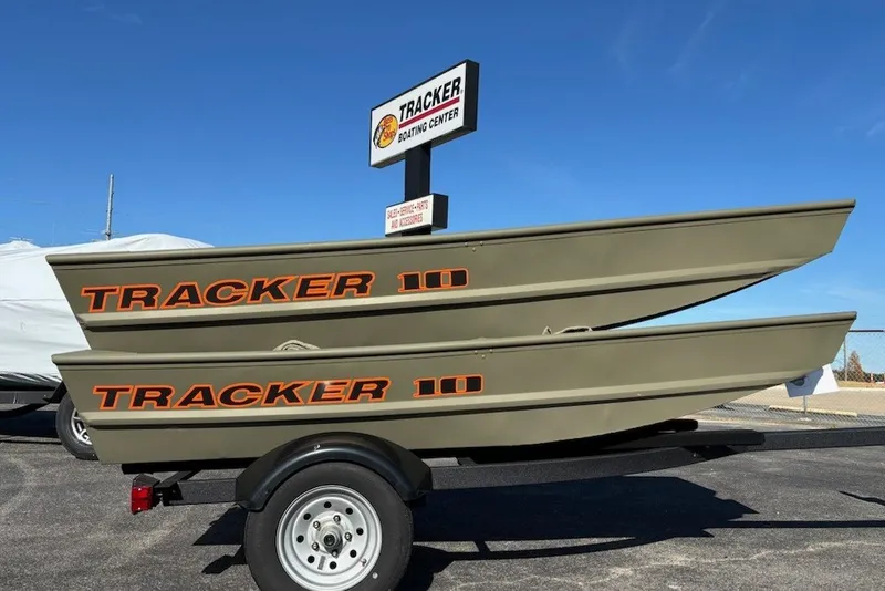 The Image of 2026 Tracker Grizzly 10 Jon boats stacked on a trailer at a boating center. - 0