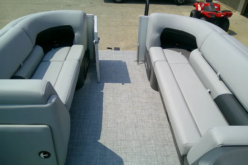 Slide: The Image of 2026 Sun Tracker Party Barge 20 DLX interior with gray seating and open deck. - 94