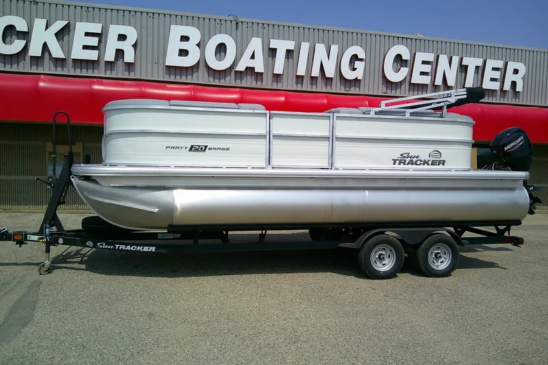 Slide: The Image of 2026 Sun Tracker Party Barge 20 DLX pontoon boat on trailer at dealership. - 88