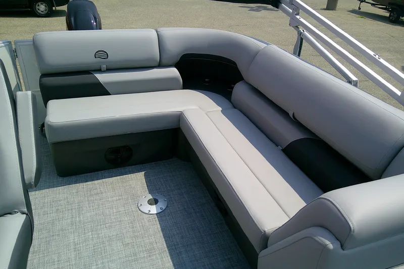 Slide: The Image of 2026 Sun Tracker Party Barge 20 DLX interior seating with gray upholstery. - 96