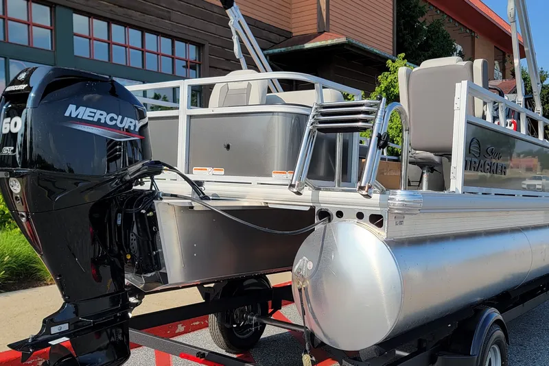 Slide: The Image of 2026 Sun Tracker Bass Buggy 18 DLX pontoon boat with Mercury outboard motor. - 80
