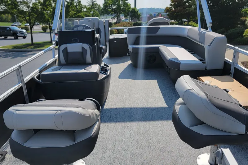 Slide: The Image of 2026 Sun Tracker Bass Buggy 18 DLX pontoon boat interior with comfortable seating and modern design. - 2