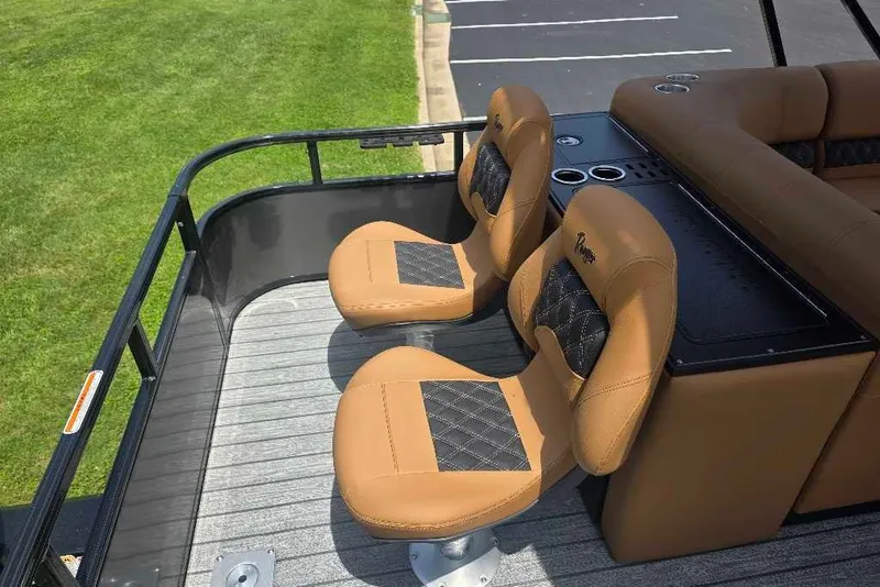 Slide: The Image of Luxury seating on 2026 Ranger 220FC boat, featuring tan and black upholstery. - 8