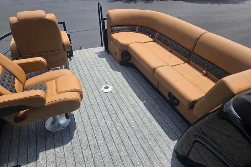 Slide: The Image of Luxurious seating on 2026 Ranger 220FC boat with tan upholstery and modern design. - 6