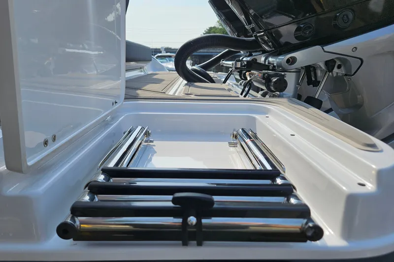 Slide: The Image of 2026 Monterey Elite 30 OB boat ladder and storage compartment detail. - 8