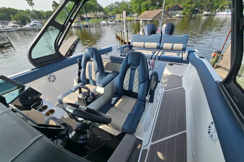 Slide: The Image of Luxurious 2026 Monterey Elite 30 OB boat interior with plush seating and modern controls. - 22