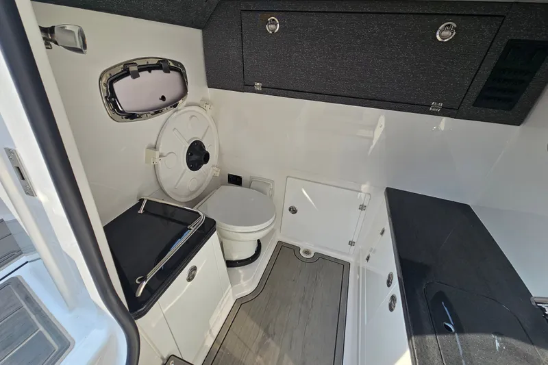 Slide: The Image of 2026 Monterey Elite 30 OB boat interior with modern bathroom amenities. - 31