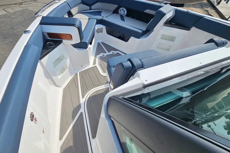 Slide: The Image of Luxurious interior of 2026 Monterey Elite 30 OB boat with sleek seating and modern design. - 24