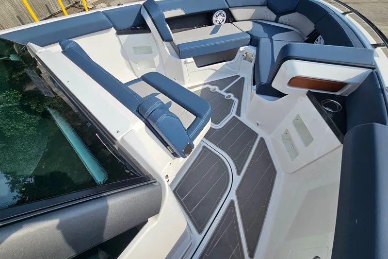 Slide: The Image of Luxurious interior of 2026 Monterey Elite 30 OB boat with blue seating and sleek design. - 25