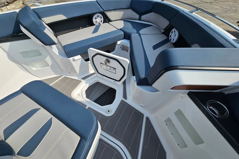Slide: The Image of 2026 Monterey Elite 30 OB boat interior with luxurious seating and storage compartments. - 26