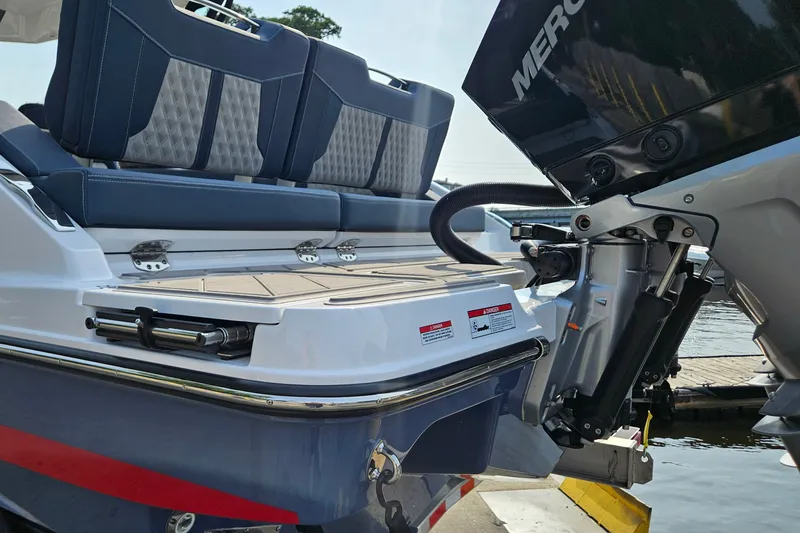 Slide: The Image of 2026 Monterey Elite 30 OB boat with sleek seating and powerful outboard motor. - 7