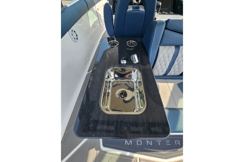 Slide: The Image of Luxury sink area on 2026 Monterey Elite 30 OB boat with sleek design. - 21