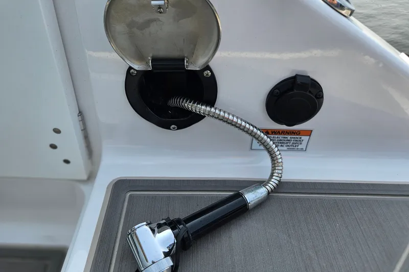Slide: The Image of Water hose outlet on a 2026 Monterey Elite 30 OB boat deck. - 16