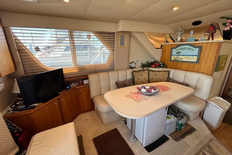 Slide: The Image of Interior of a 1999 Silverton 351 Sedan yacht with cozy seating and decor. - 13