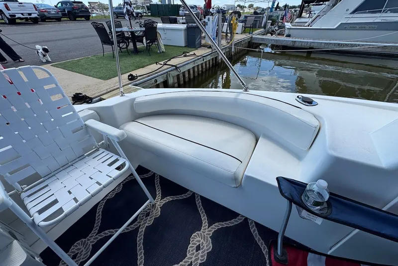 Slide: The Image of 1999 Silverton 351 Sedan boat interior with seating, docked at marina. - 5