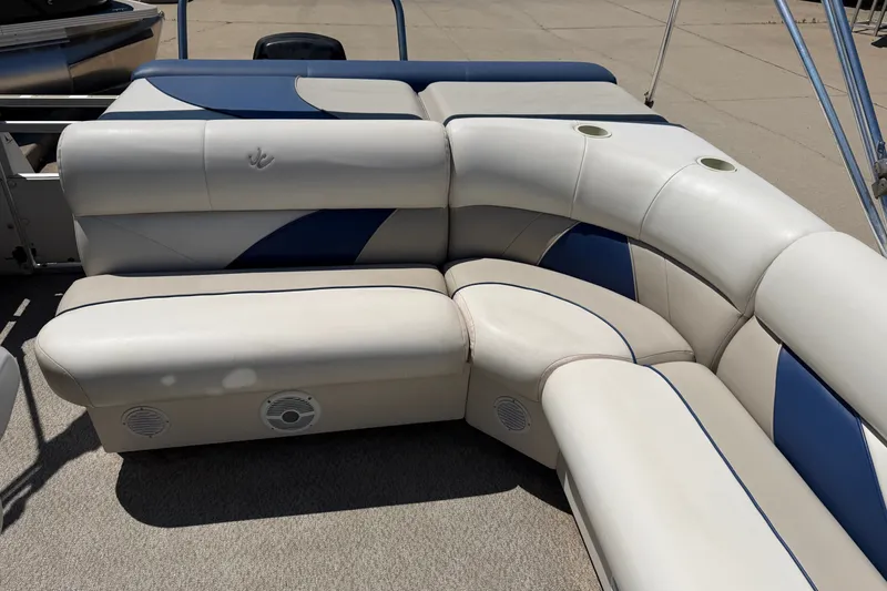 Slide: The Image of 2005 JC 21 NEPTOON TT pontoon boat seating with blue and white upholstery. - 11