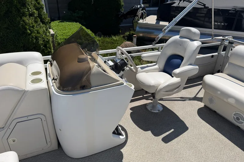 Slide: The Image of 2005 JC 21 NEPTOON TT boat interior with steering console and seating area. - 8