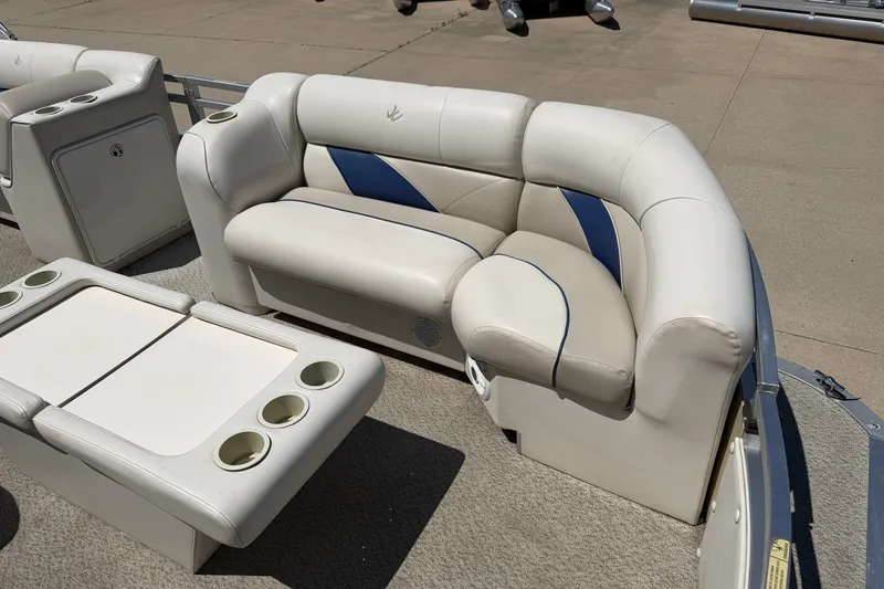 Slide: The Image of 2005 JC 21 NEPTOON TT pontoon boat seating with cup holders and storage compartments. - 5