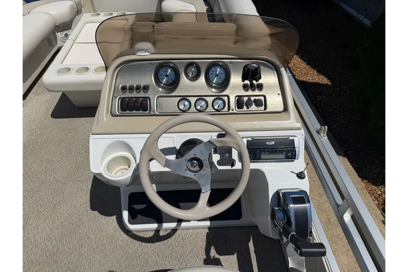 Slide: The Image of 2005 JC 21 NEPTOON TT boat dashboard with steering wheel and control panel. - 13