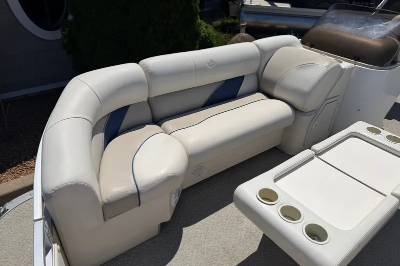 Slide: The Image of Luxurious seating on a 2005 JC 21 NEPTOON TT boat with cup holders and plush upholstery. - 6