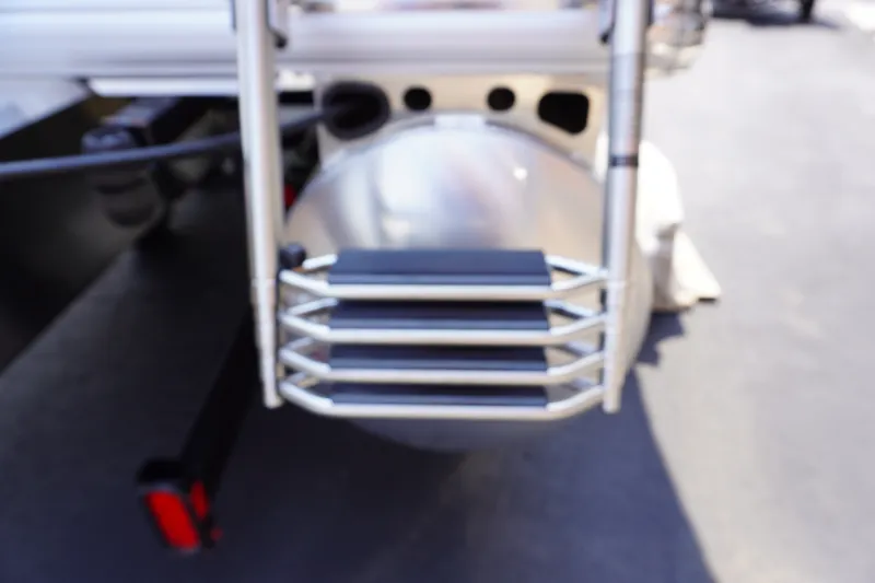 Slide: The Image of Rear view of 2027 Sun Tracker Bass Buggy 16 DLX pontoon boat ladder. - 4
