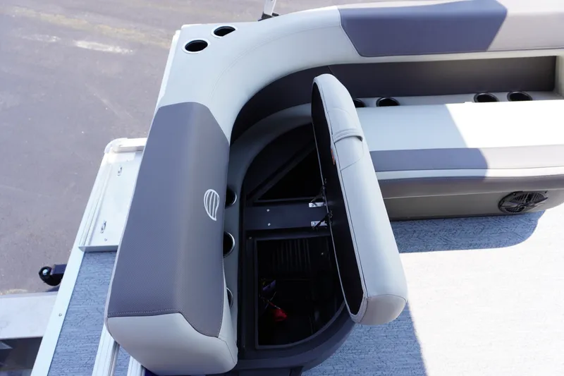Slide: The Image of 2027 Sun Tracker Bass Buggy 16 DLX boat seat with storage compartment open. - 12