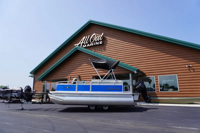 The Image of 2027 Sun Tracker Bass Buggy 16 DLX pontoon boat outside All Out Marine. - 1